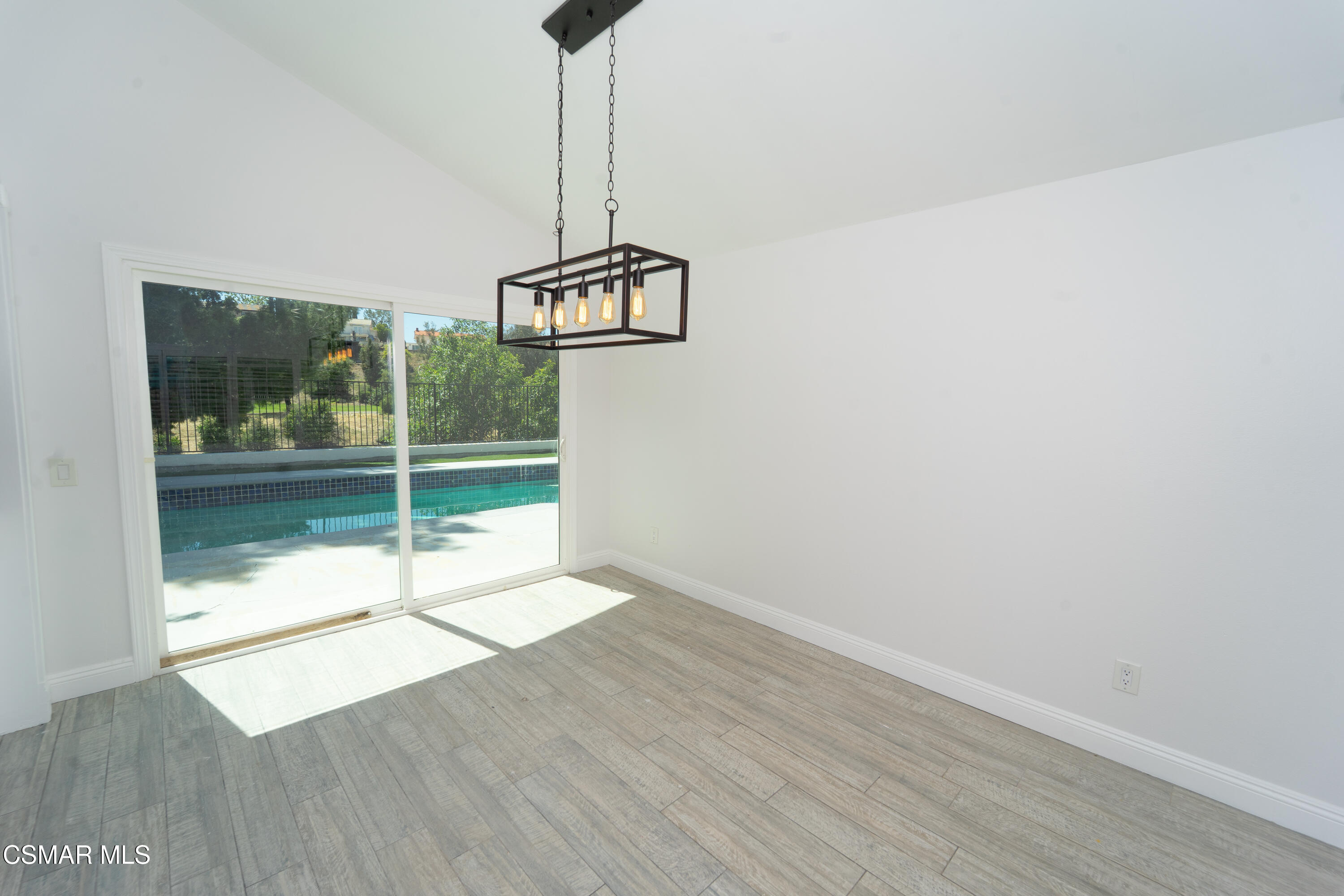 11723 Porter Valley Drive Porter Ranch, CA 91326 - Photo 11 of 64 a view of empty room with wooden floor and fan