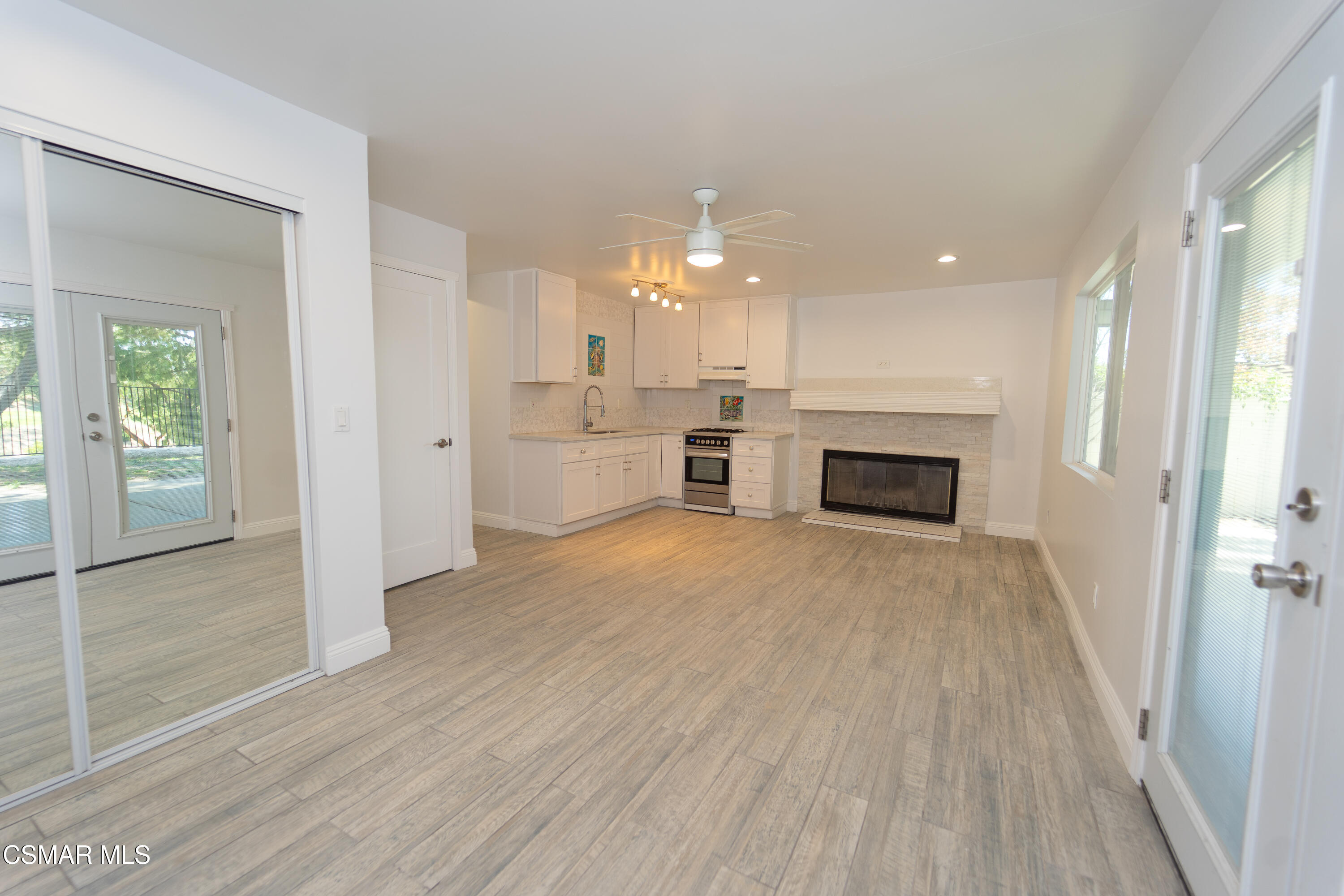 11723 Porter Valley Drive Porter Ranch, CA 91326 - Photo 19 of 64 wooden floor in an empty room with a fireplace