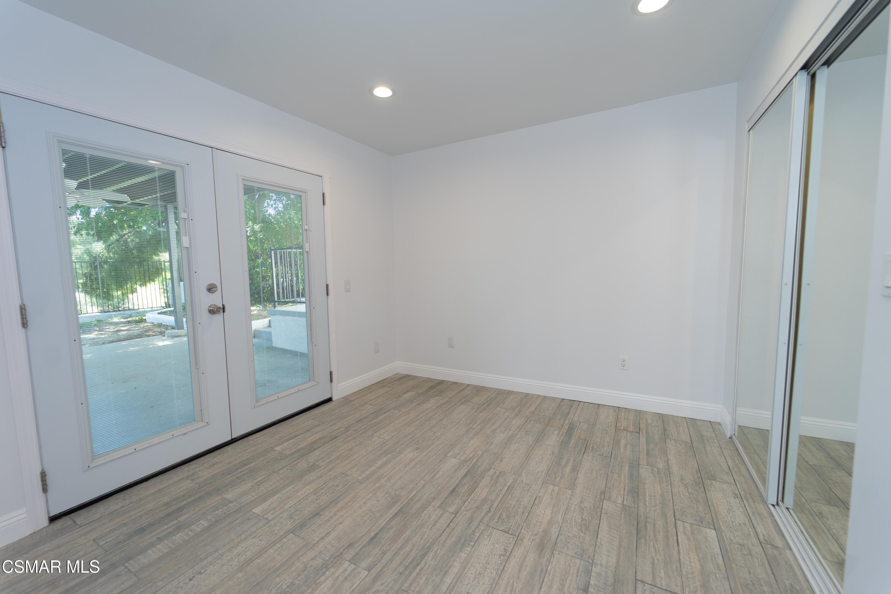 11723 Porter Valley Drive Porter Ranch, CA 91326 - Photo 23 of 64 wooden floor in an empty room with a window