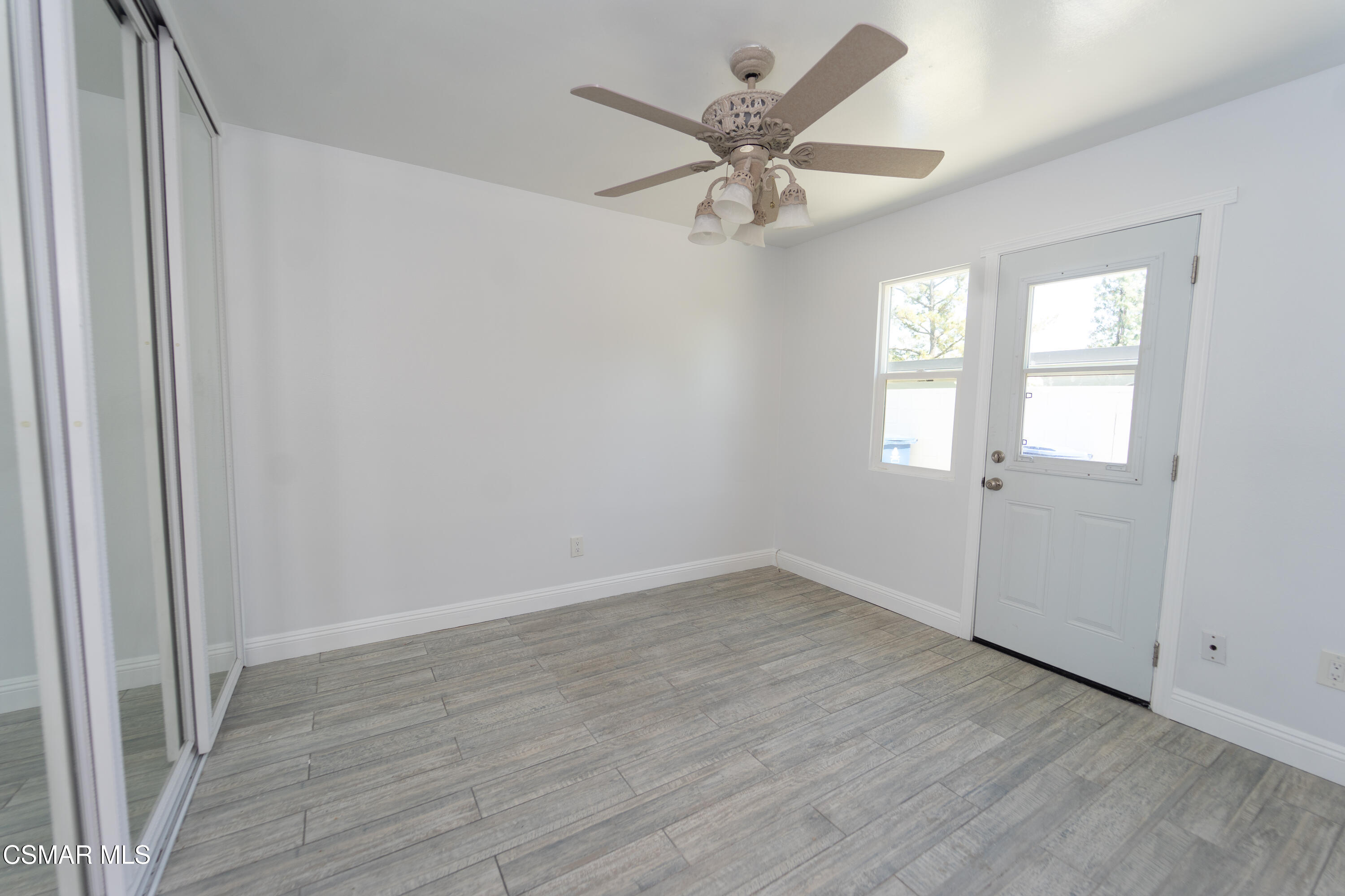 11723 Porter Valley Drive Porter Ranch, CA 91326 - Photo 24 of 64 wooden floor in an empty room with a window