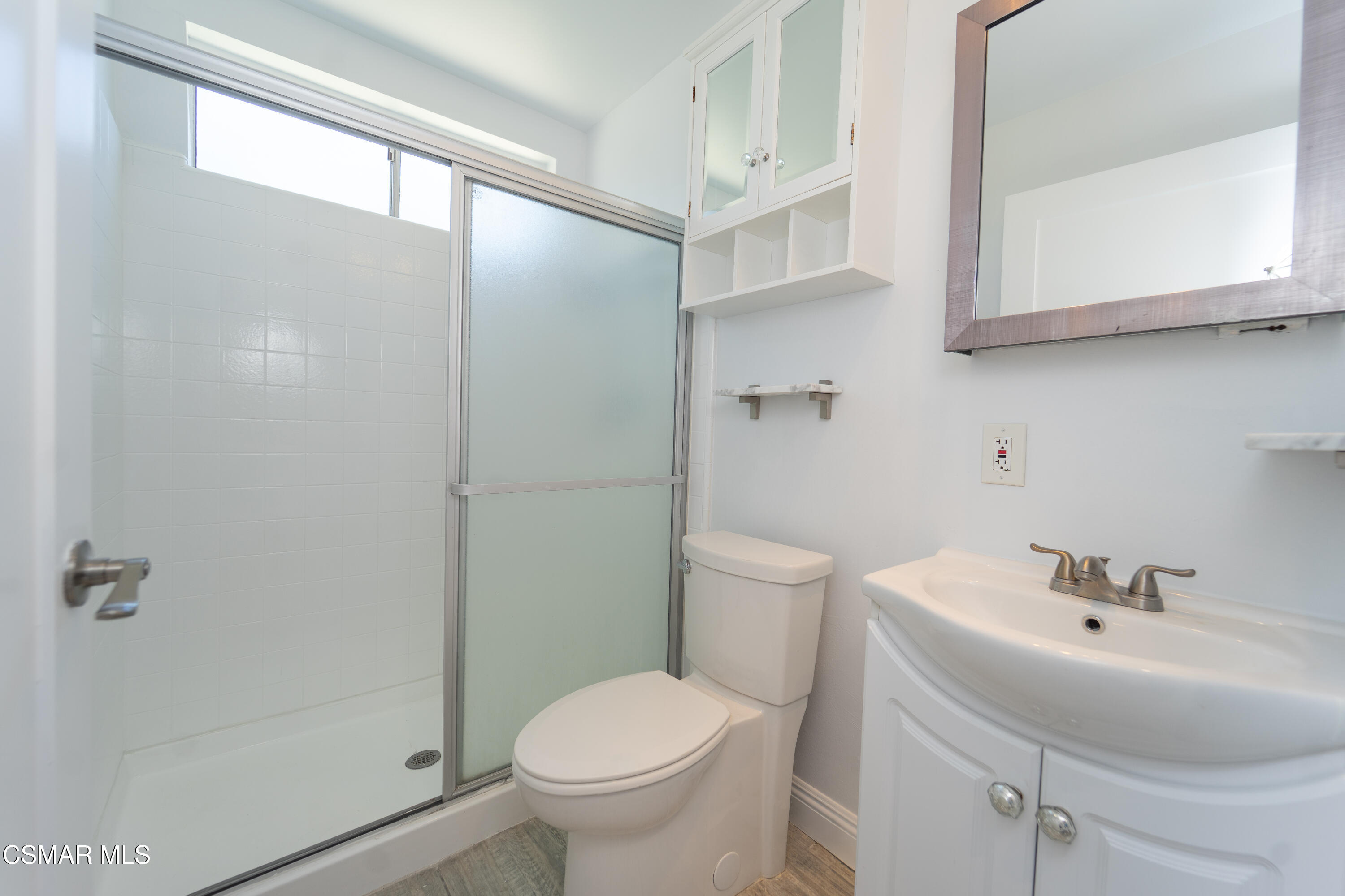 11723 Porter Valley Drive Porter Ranch, CA 91326 - Photo 25 of 64 a bathroom with a sink toilet and shower