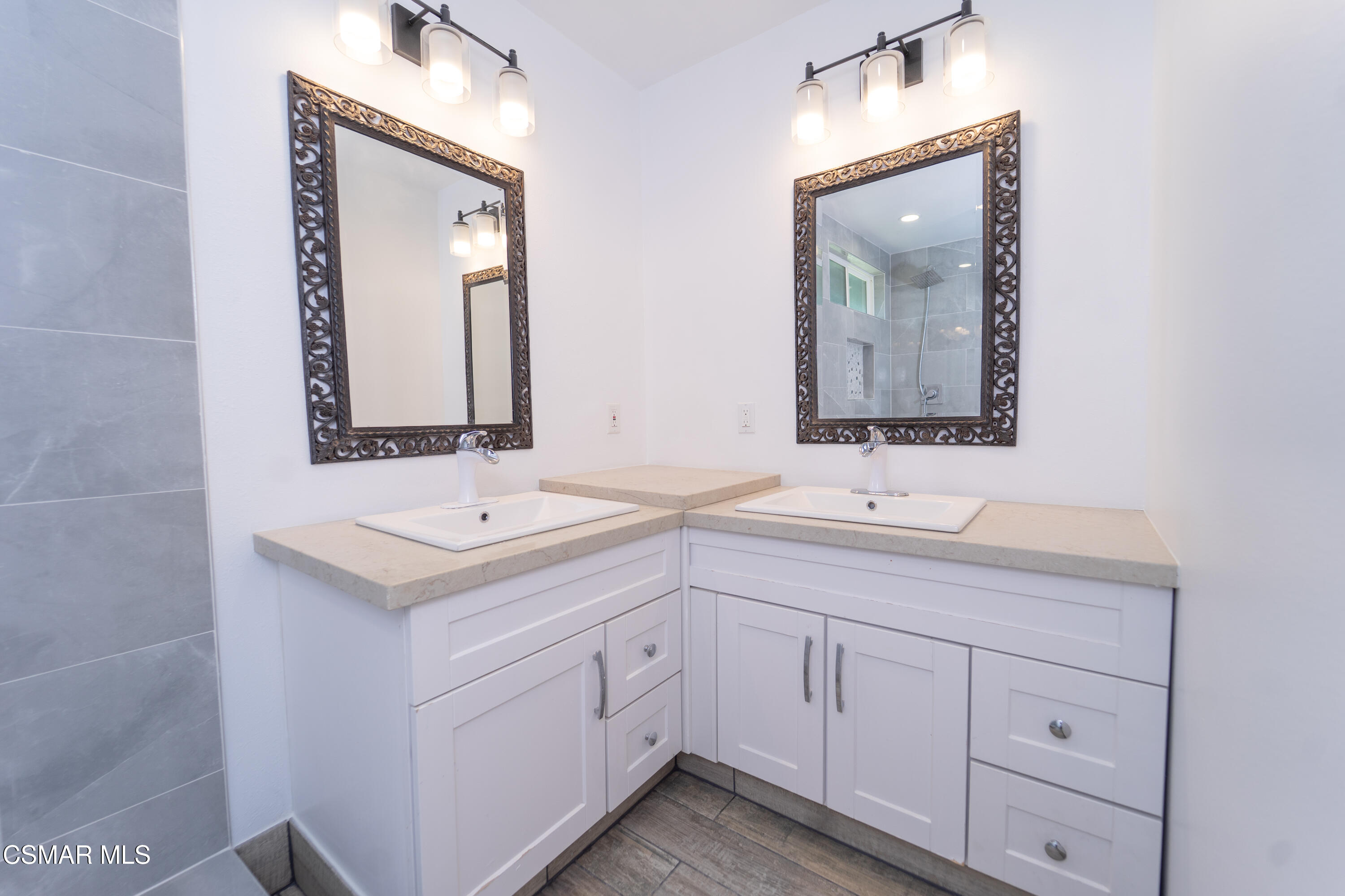 11723 Porter Valley Drive Porter Ranch, CA 91326 - Photo 33 of 64 a bathroom with a sink and a mirror