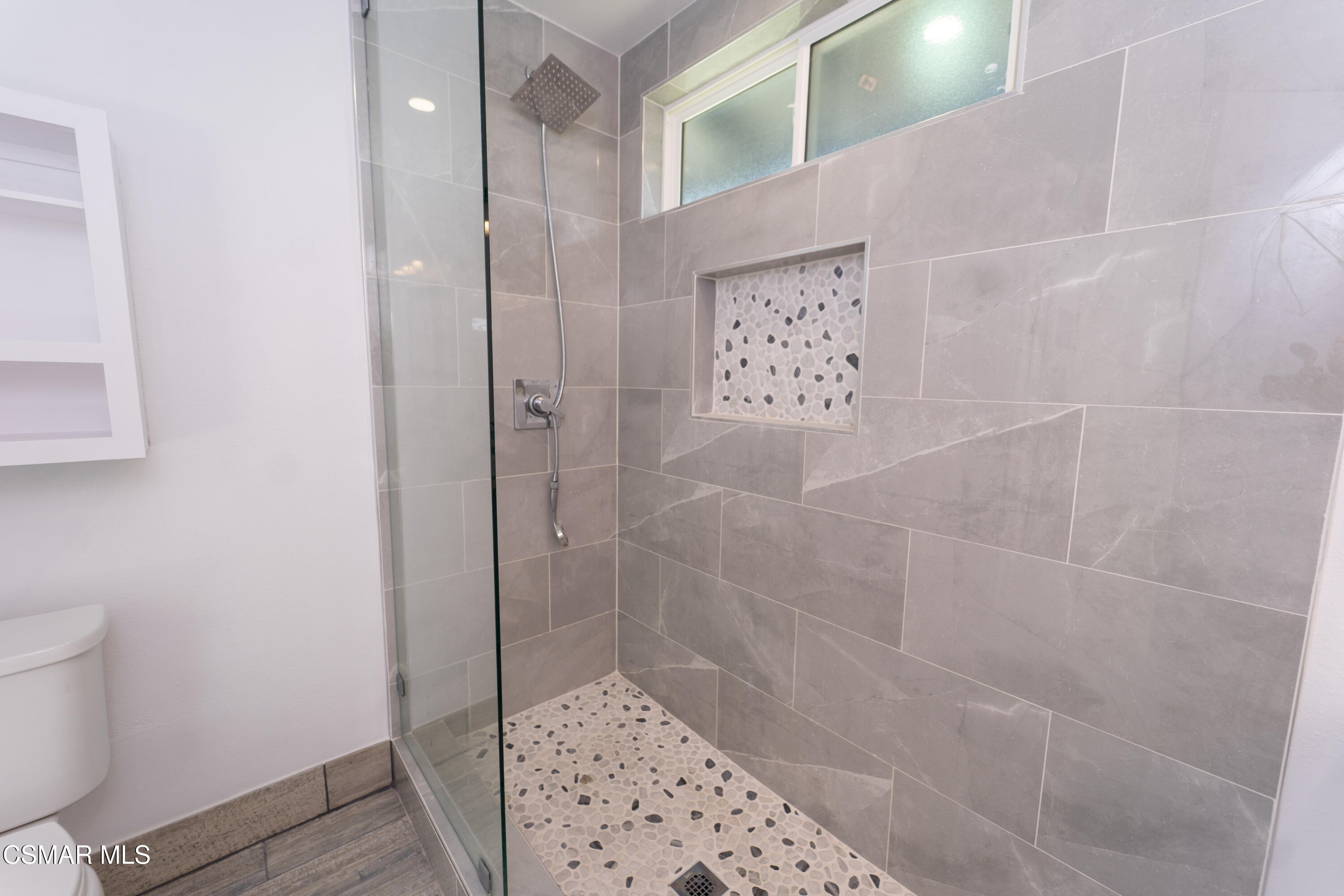 11723 Porter Valley Drive Porter Ranch, CA 91326 - Photo 34 of 64 a bathroom with a shower and toilet