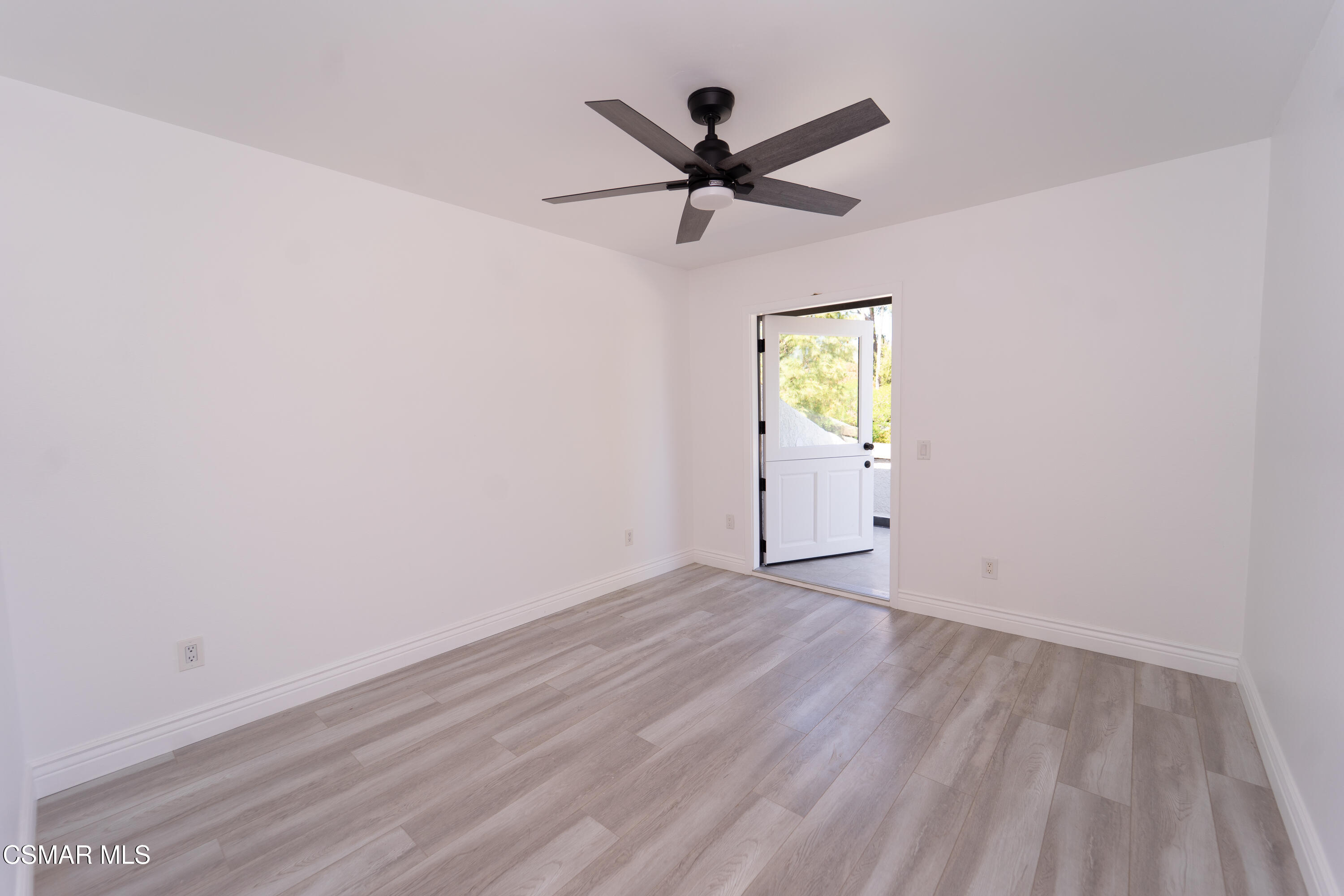 11723 Porter Valley Drive Porter Ranch, CA 91326 - Photo 35 of 64 an empty room with window and wooden floor