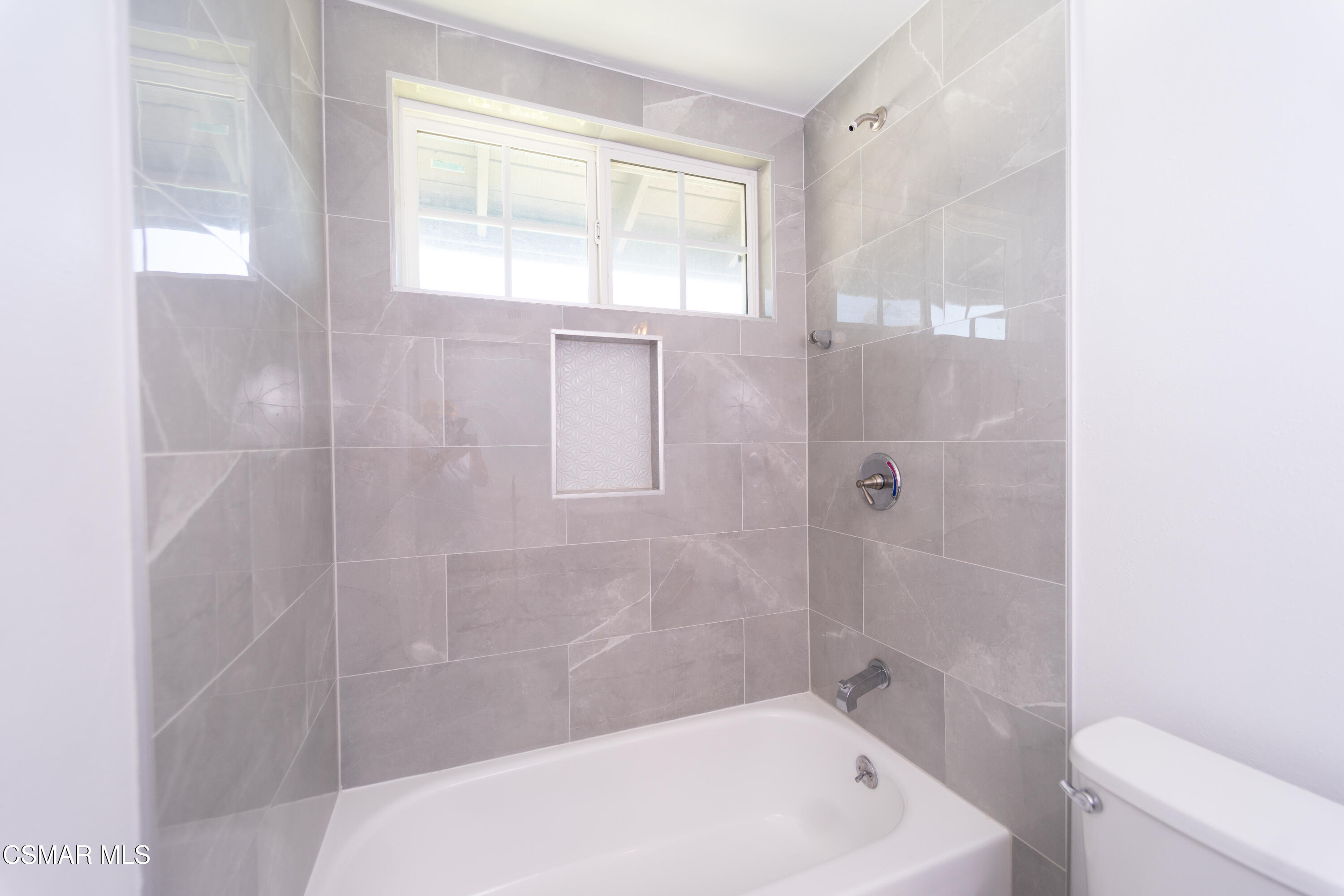 11723 Porter Valley Drive Porter Ranch, CA 91326 - Photo 40 of 64 a white bath tub sitting next to a toilet