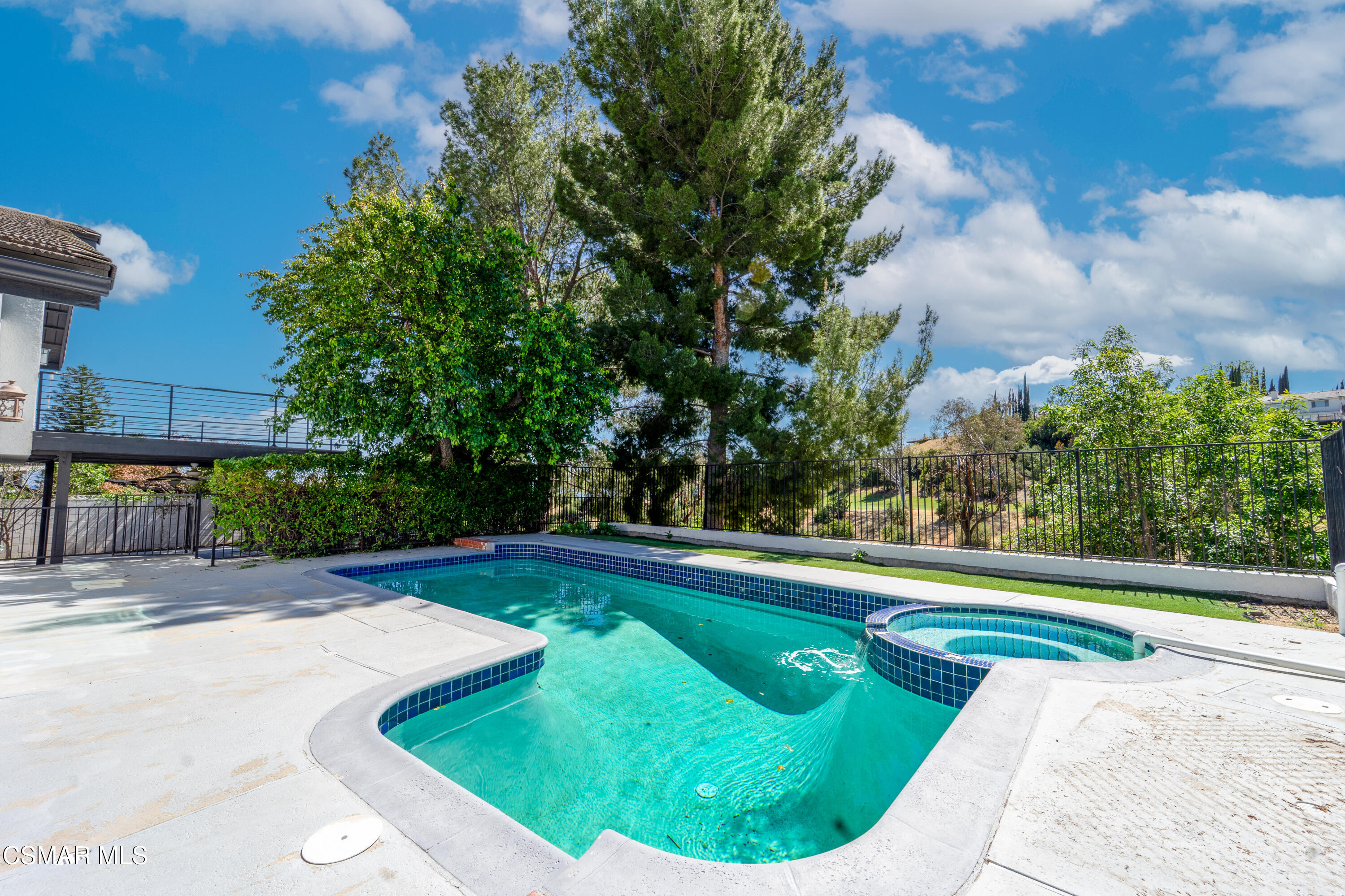 11723 Porter Valley Drive Porter Ranch, CA 91326 - Photo 44 of 64 a view of a swimming pool in a backyard