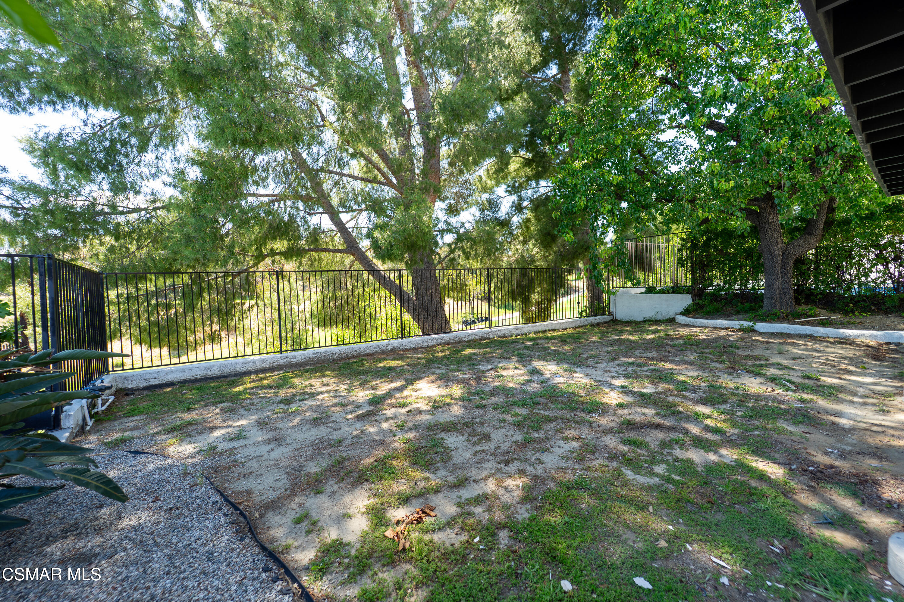 11723 Porter Valley Drive Porter Ranch, CA 91326 - Photo 47 of 64 a backyard of a house with large trees