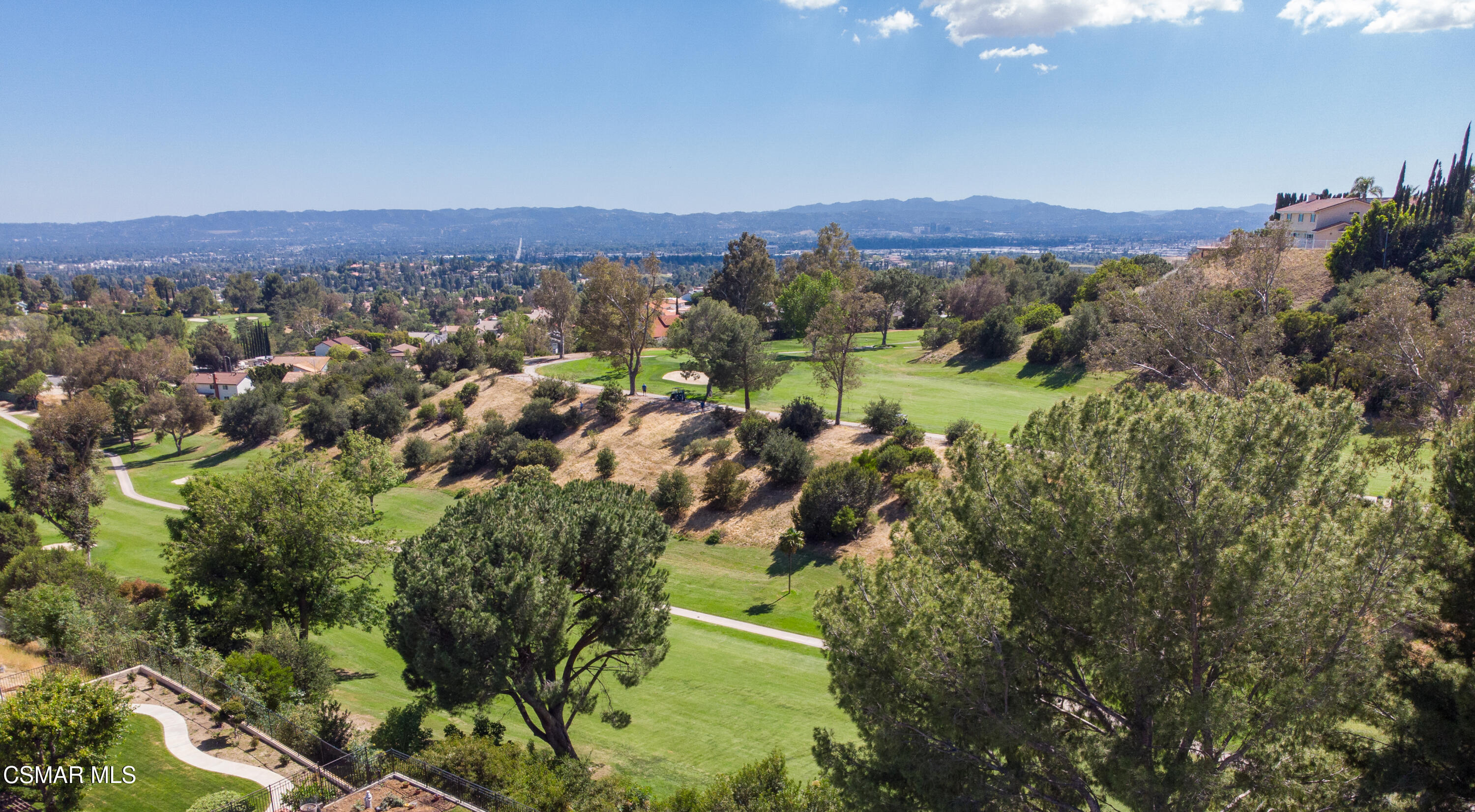 11723 Porter Valley Drive Porter Ranch, CA 91326 - Photo 54 of 64 a view of a city with mountains in the background