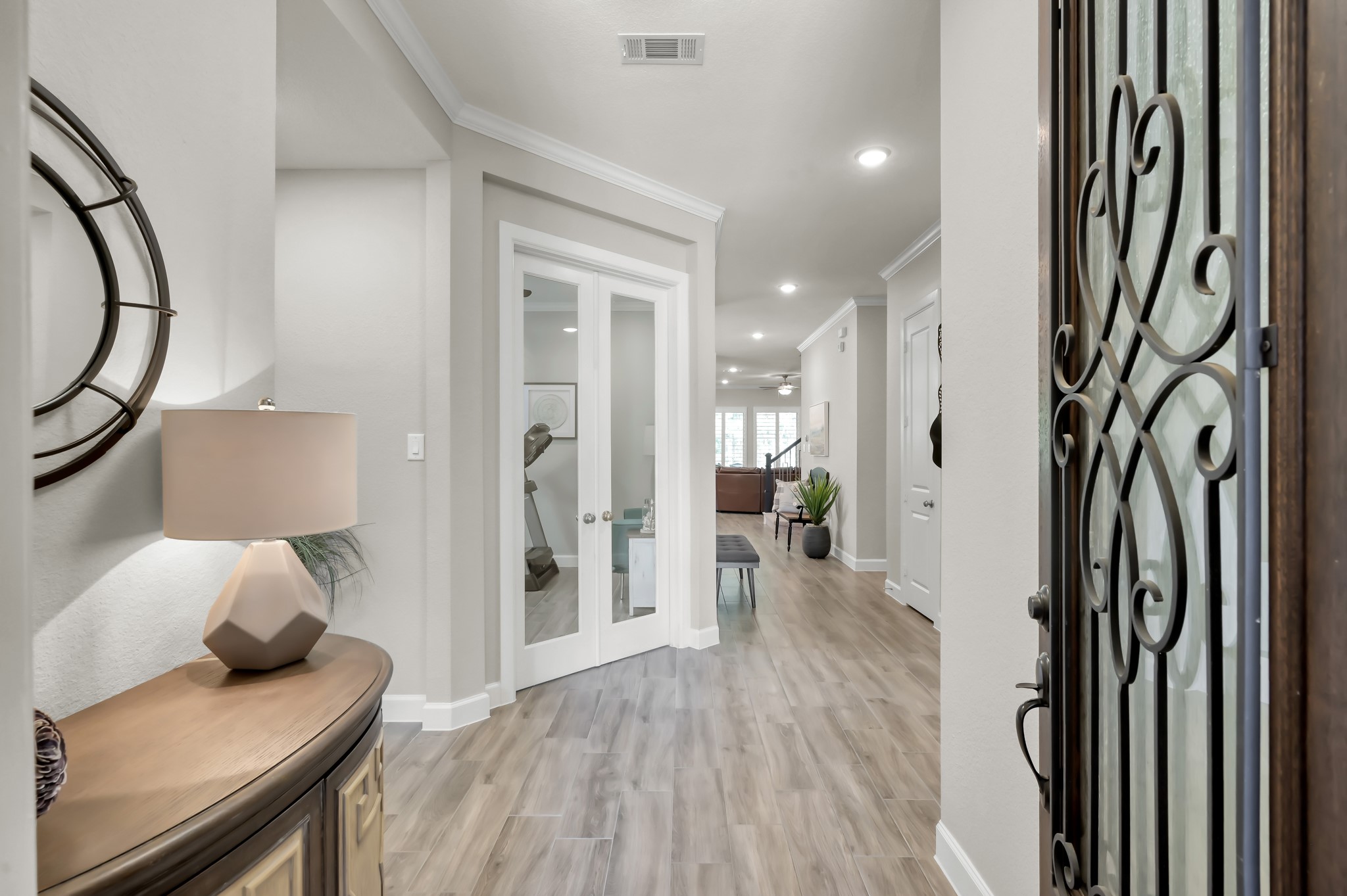 334 Torrey Bloom Loop Conroe, TX 77304 - Photo 9 of 47 Welcoming entry with wood-look flooring, neutral tones, bright, open, and inviting from the moment you step inside.