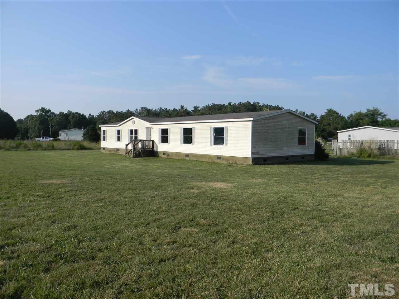6899 Driver Road Zebulon, NC 27597 - Photo 2 of 16 a view of a house with a yard