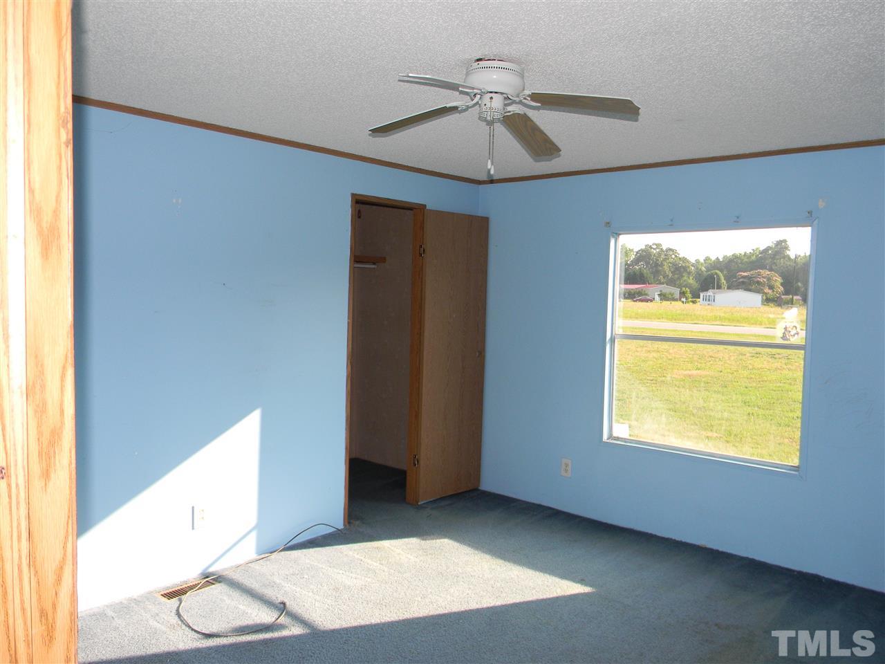 6899 Driver Road Zebulon, NC 27597 - Photo 12 of 16 a view of an empty room with window