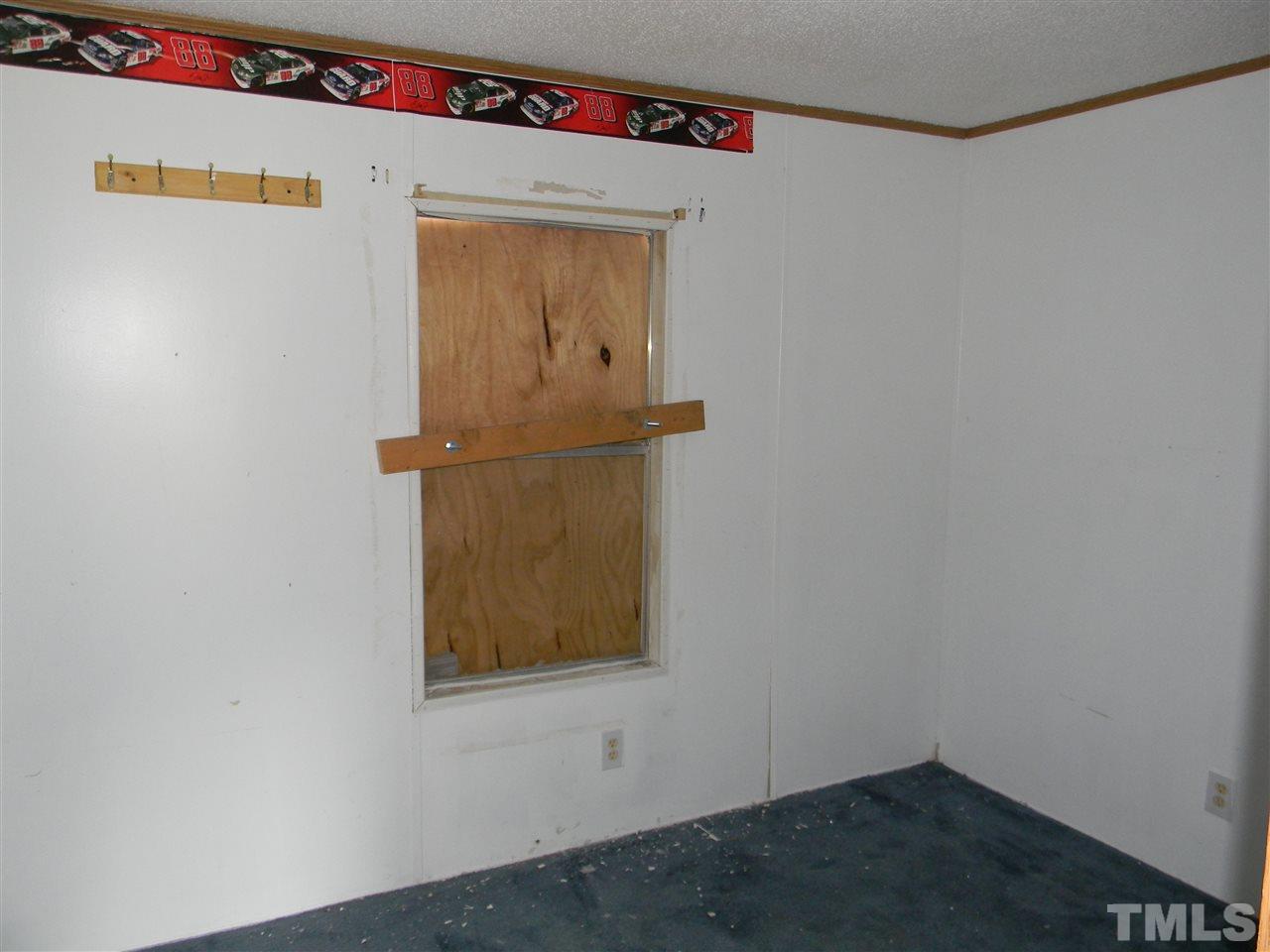 6899 Driver Road Zebulon, NC 27597 - Photo 15 of 16 a utility room with a window