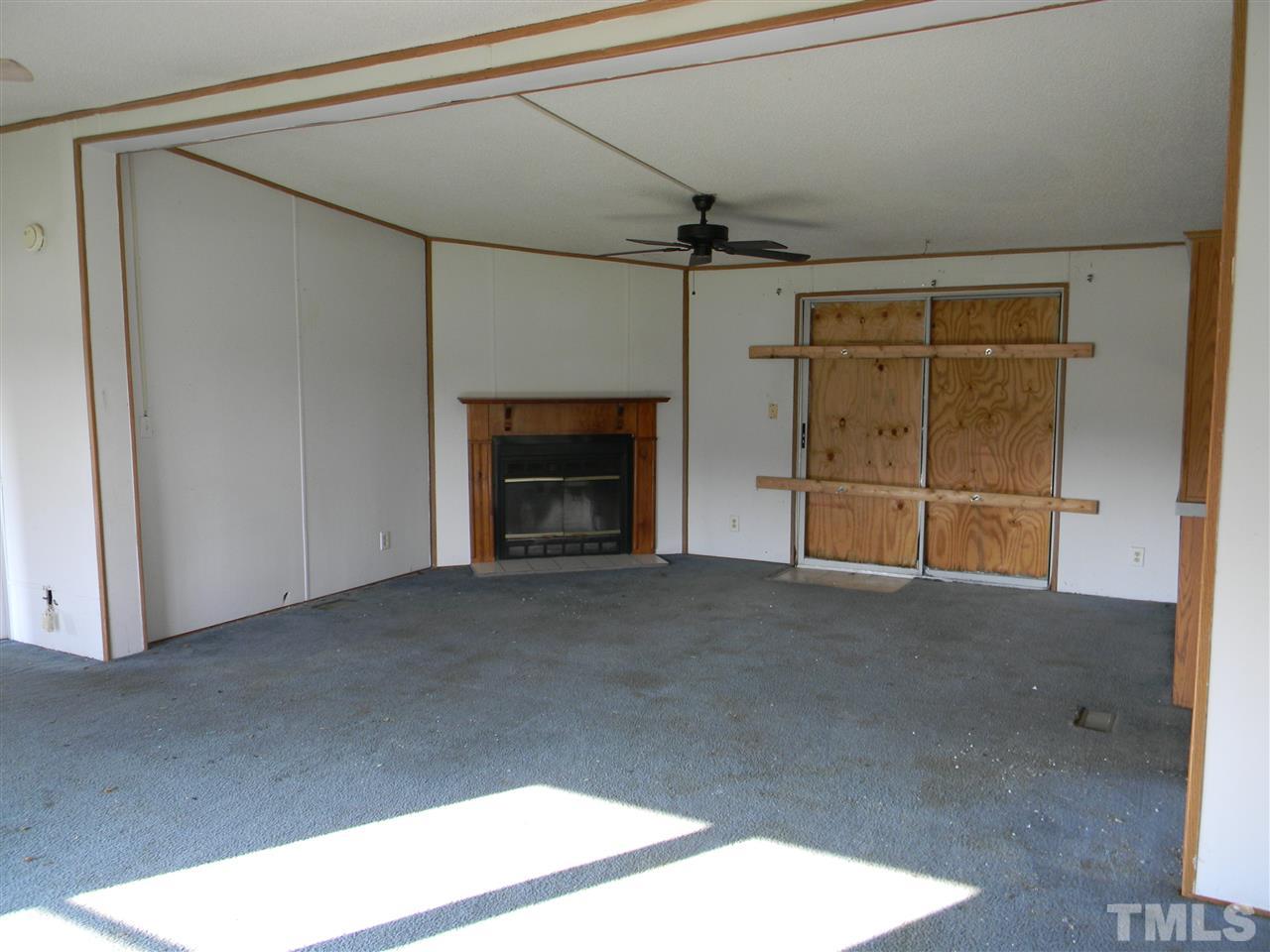 6899 Driver Road Zebulon, NC 27597 - Photo 4 of 16 a view of empty room with a fireplace