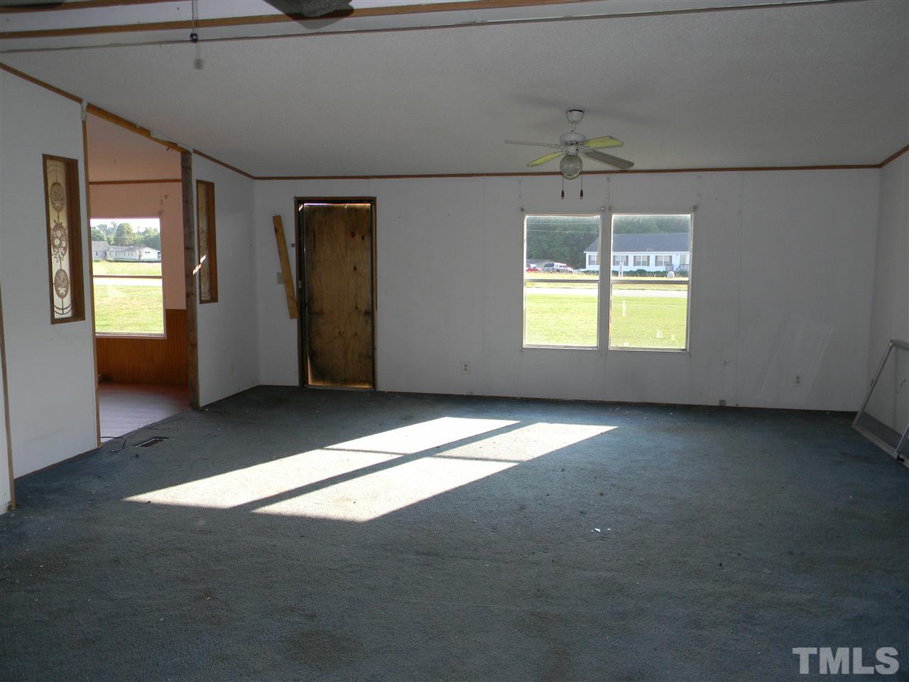 6899 Driver Road Zebulon, NC 27597 - Photo 5 of 16 a view of an empty room with a window