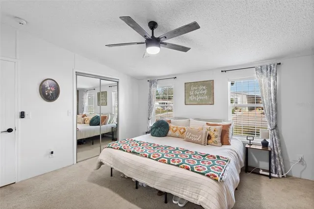 a bedroom with a bed and window