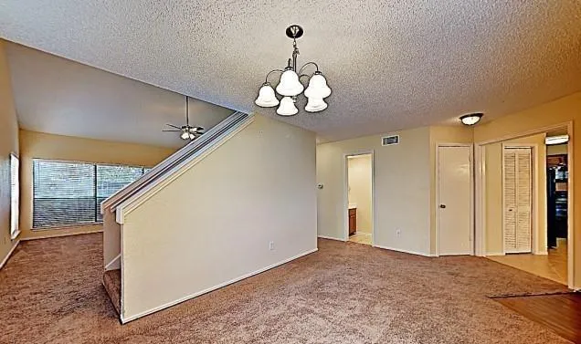 a very nice looking hallway with a chandelier