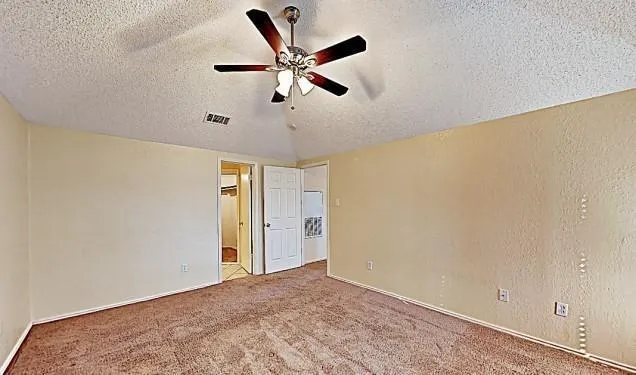 a view of a big room with carpet and wooden floor