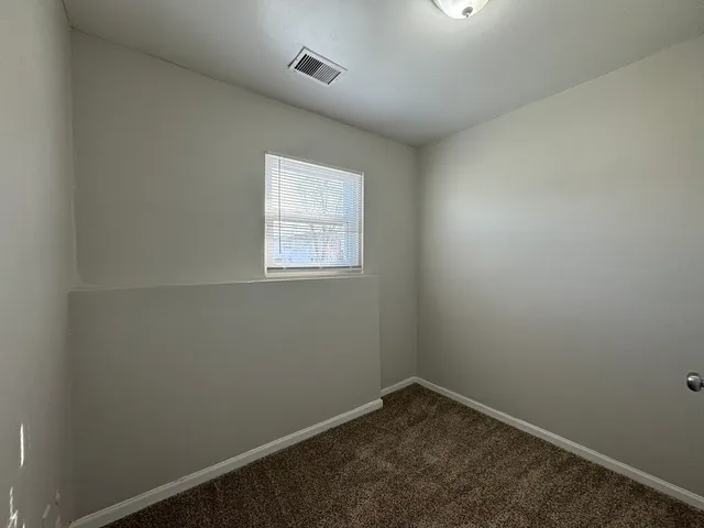 a bathroom with a tub and a shower