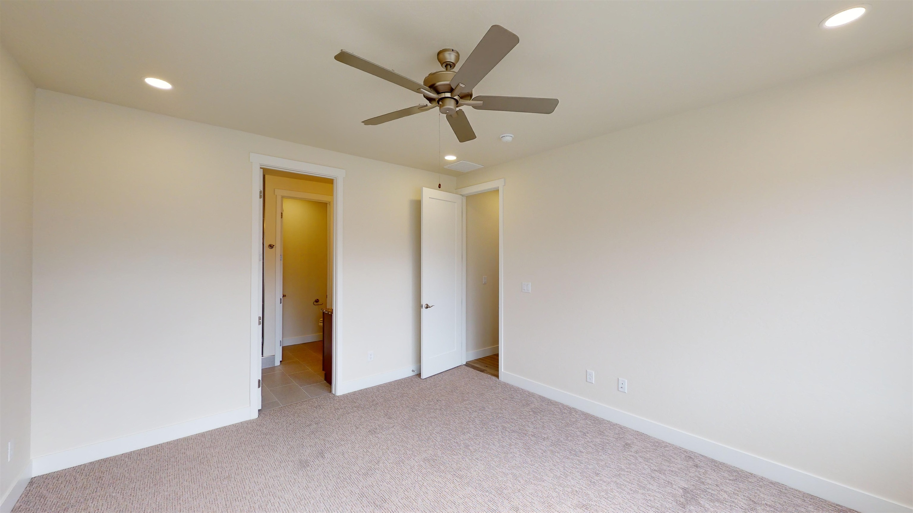 1747 Iron Drive Fruita, CO 81521 - Photo 12 of 30 a view of a livingroom with a ceiling fan and window