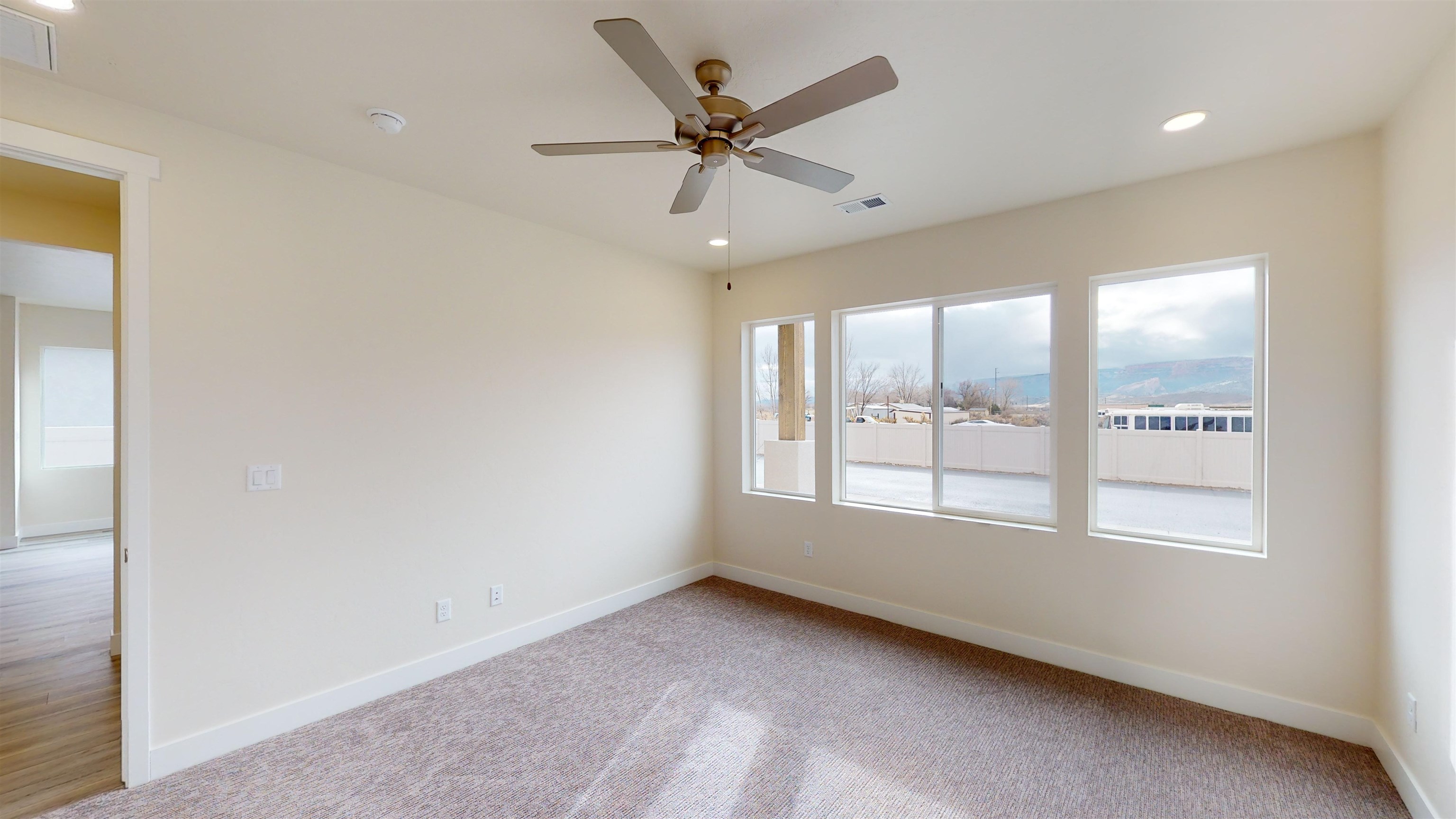 1747 Iron Drive Fruita, CO 81521 - Photo 13 of 30 a view of an empty room with a window