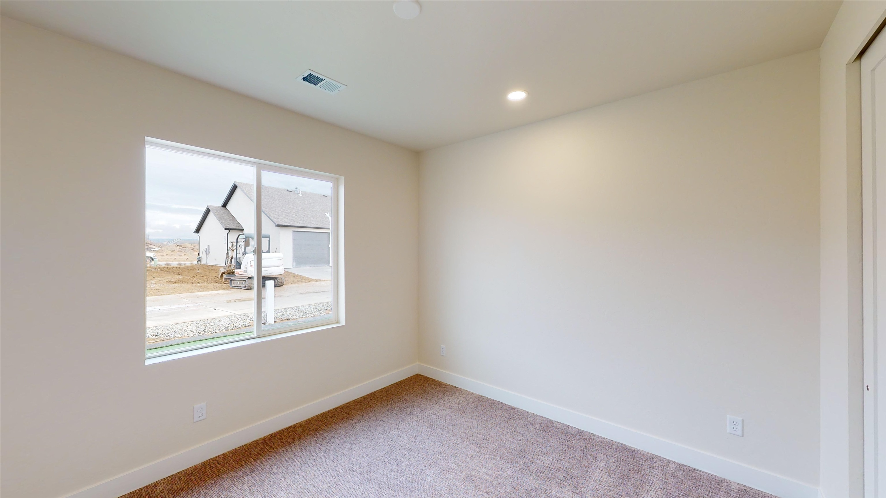 1747 Iron Drive Fruita, CO 81521 - Photo 14 of 30 an empty room with windows and