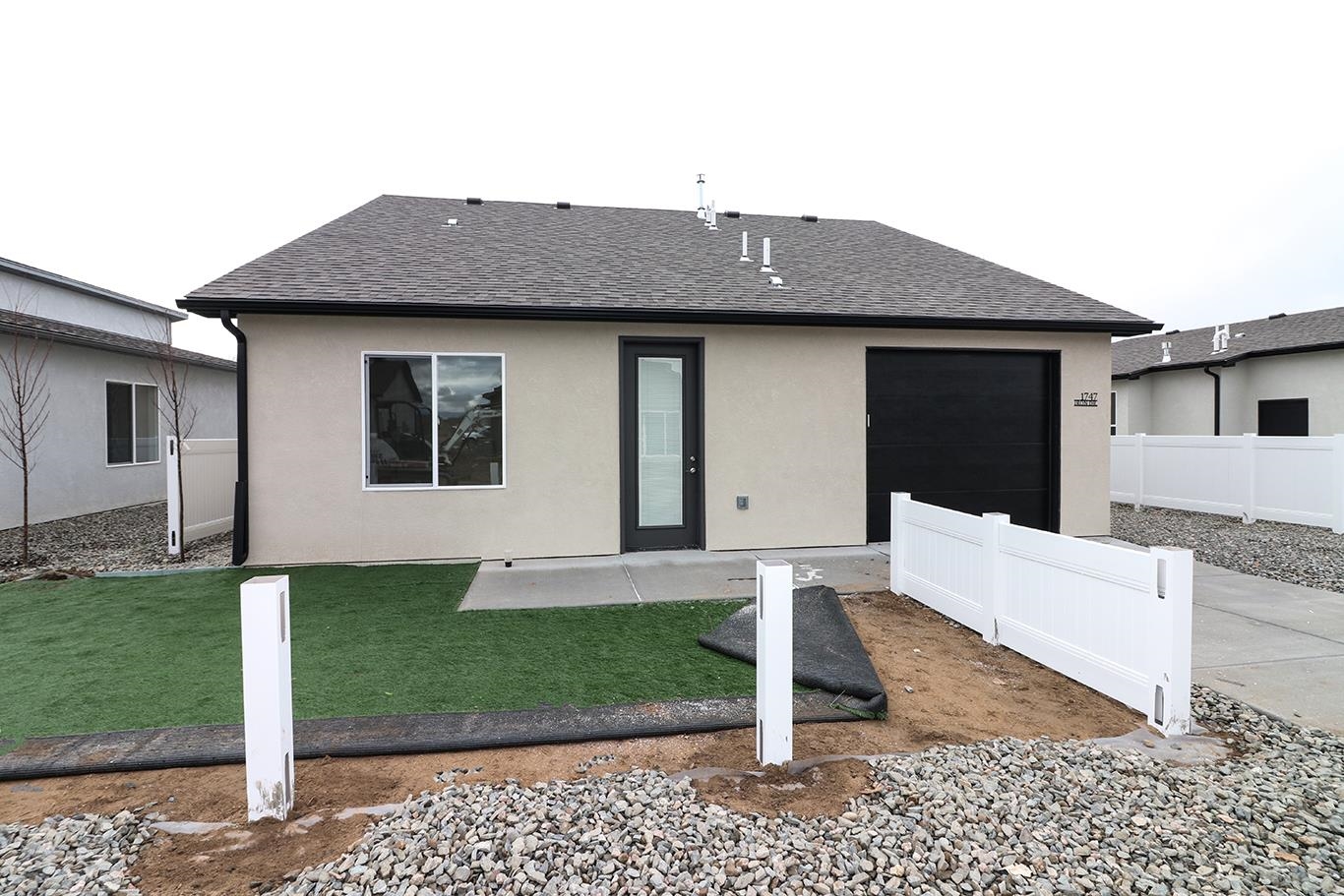1747 Iron Drive Fruita, CO 81521 - Photo 22 of 30 a front view of a house with a yard