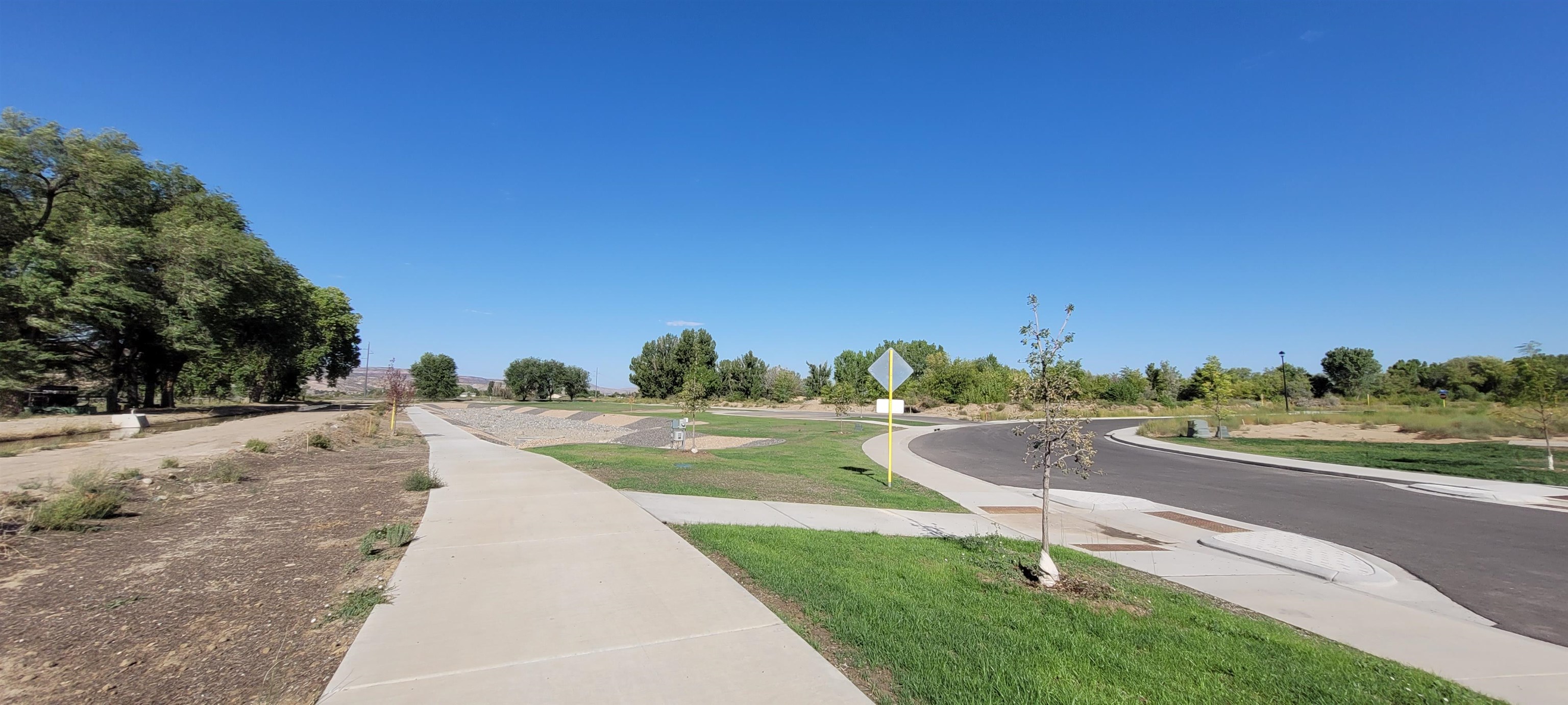 1747 Iron Drive Fruita, CO 81521 - Photo 25 of 30 a view of a street with a big yard