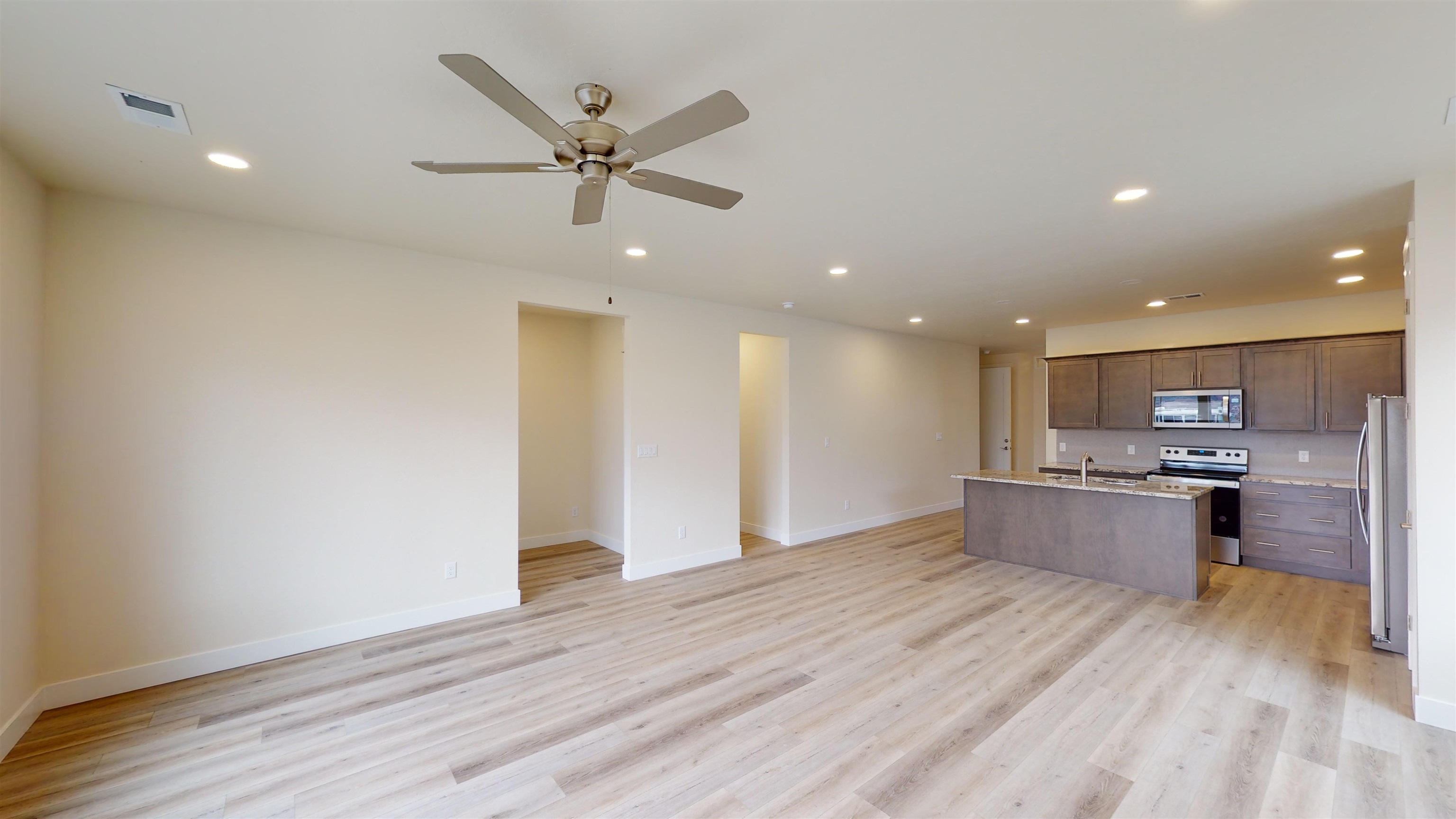 1747 Iron Drive Fruita, CO 81521 - Photo 4 of 30 a view of kitchen with cabinets and wooden floor