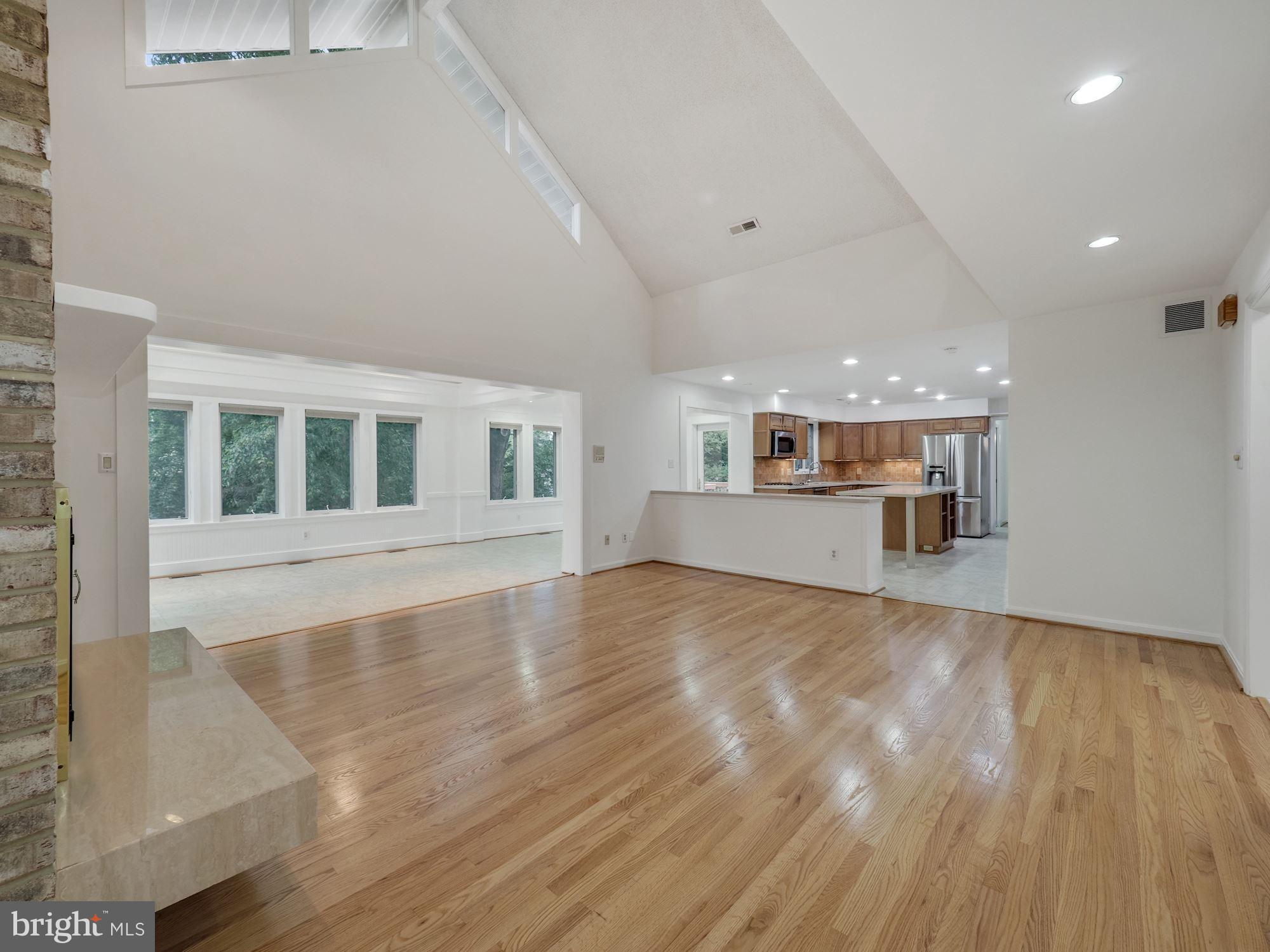 14700 Chesterfield Road Rockville, MD 20853 - Photo 10 of 44 Great Room Opening to Sun Room