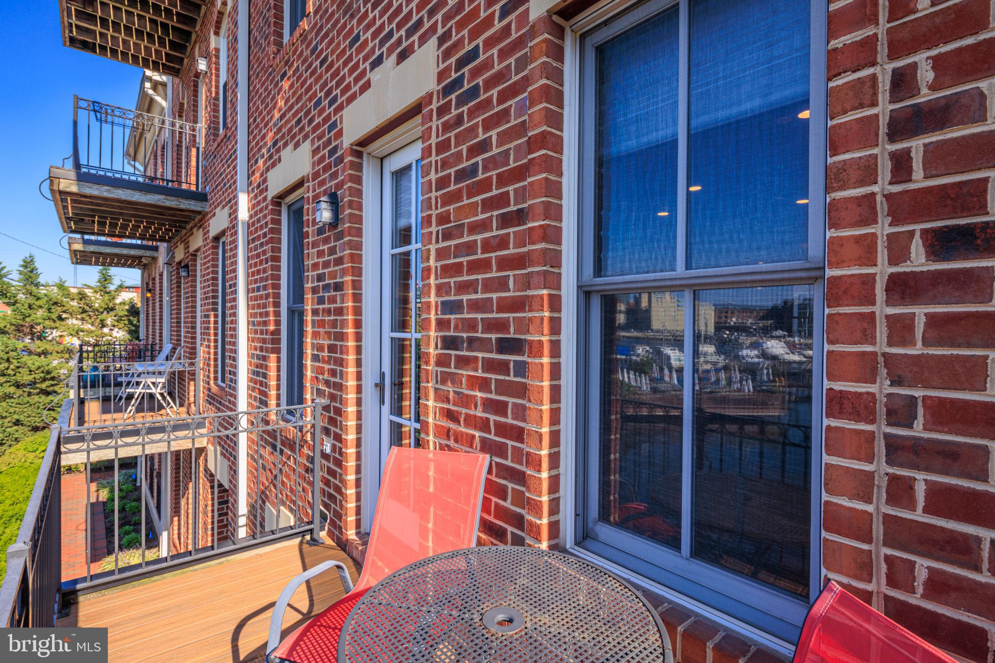 2317 Boston Street, Unit 3 Baltimore, MD 21224 - Photo 11 of 51 a view of a brick building with many windows