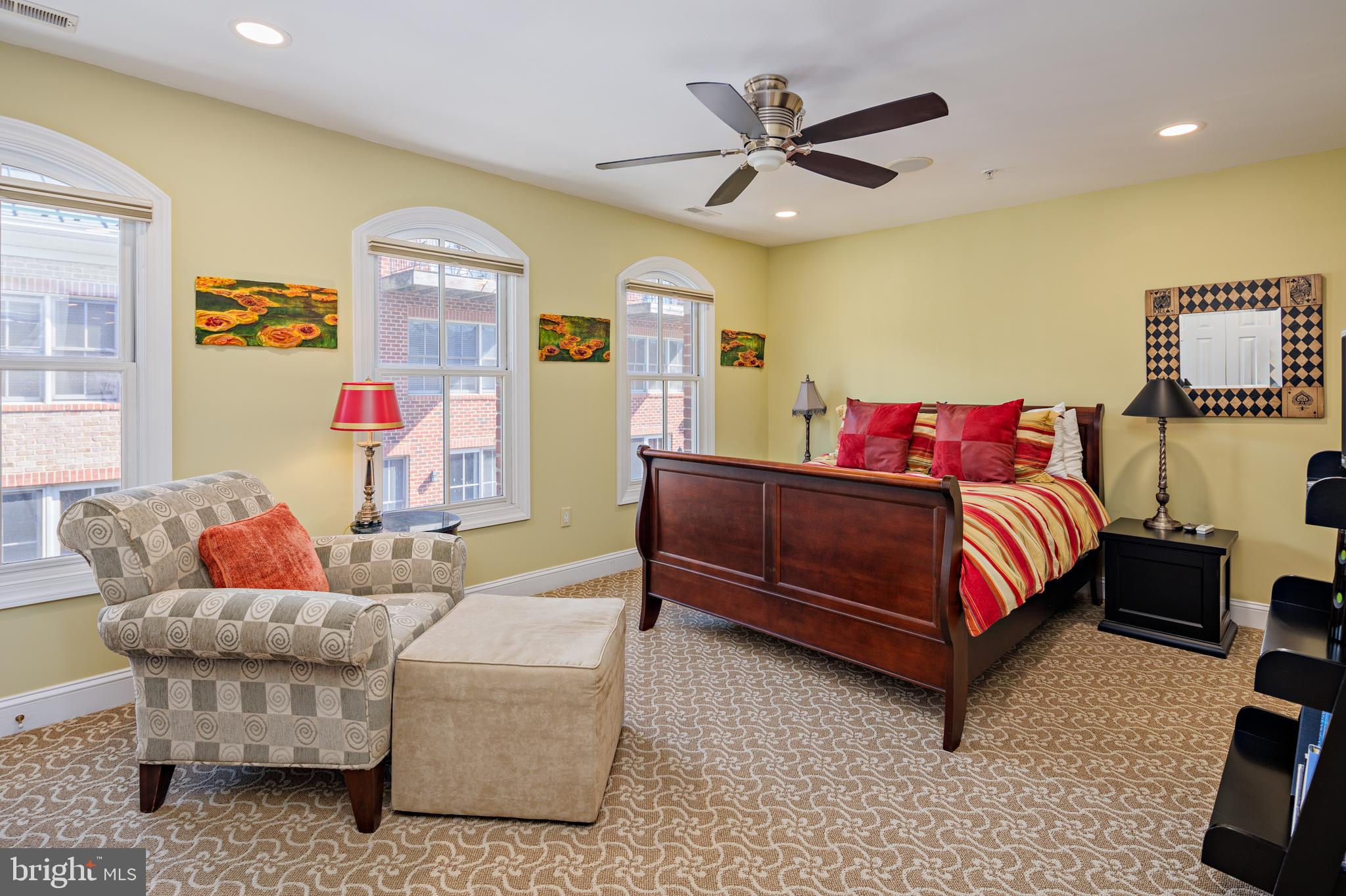 2317 Boston Street, Unit 3 Baltimore, MD 21224 - Photo 24 of 51 a bedroom with a bed and wooden floor