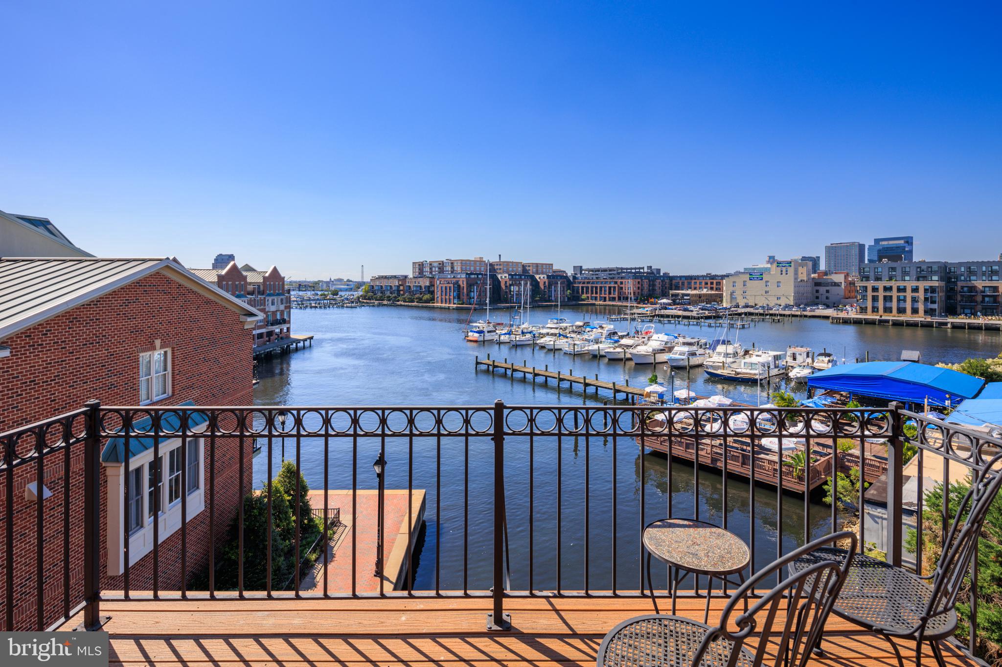 2317 Boston Street, Unit 3 Baltimore, MD 21224 - Photo 37 of 51 a view of a chairs and table on the roof deck