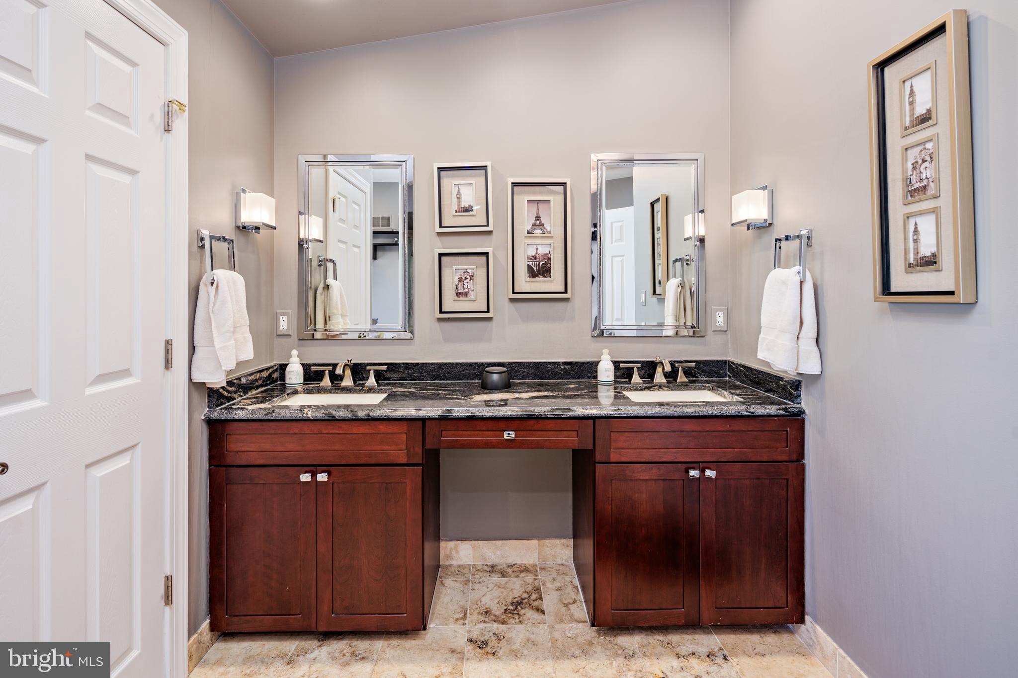 2317 Boston Street, Unit 3 Baltimore, MD 21224 - Photo 42 of 51 a spacious bathroom with a granite countertop sink and a mirror
