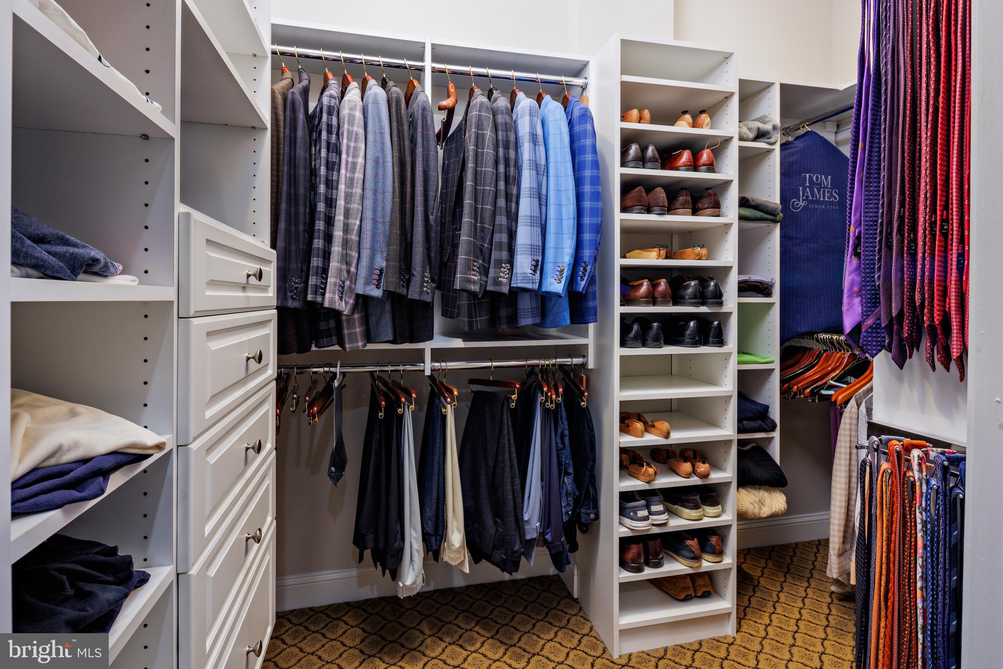 2317 Boston Street, Unit 3 Baltimore, MD 21224 - Photo 43 of 51 a view of walk in closet with clothes and shoes