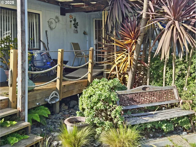 a view of a garden with lawn chairs