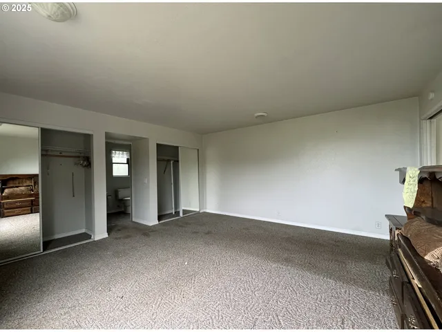 a bathroom with a sink toilet a mirror and shower