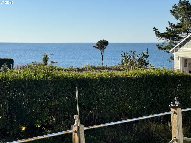 a white bath tub sitting next to a toilet