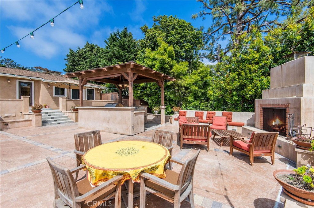 1 Thyme Place Rancho Palos Verdes, CA 90275 - Photo 13 of 35 a view of a patio with couches table and chairs and potted plants