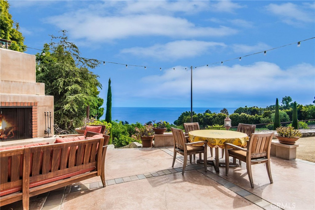 1 Thyme Place Rancho Palos Verdes, CA 90275 - Photo 19 of 35 a view of a patio with a table and chairs