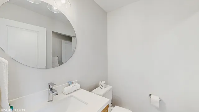 a bathroom with a sink and mirror