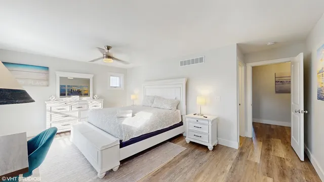 a spacious bedroom with a bed and a couch