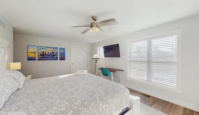 a bedroom with a large bed and a window