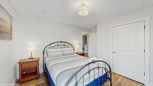 a bathroom with a double vanity sink toilet and a mirror