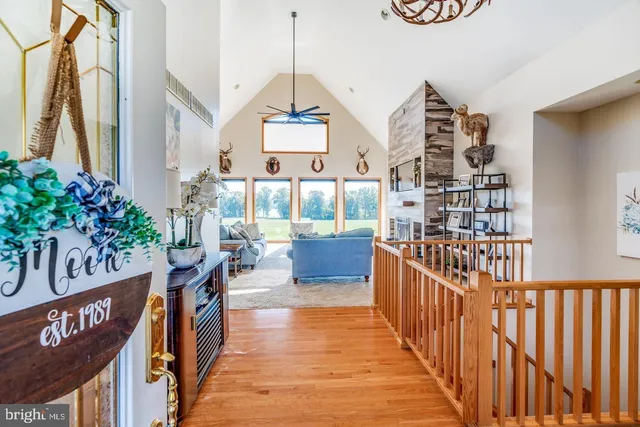 a view of a chairs and table in the balcony