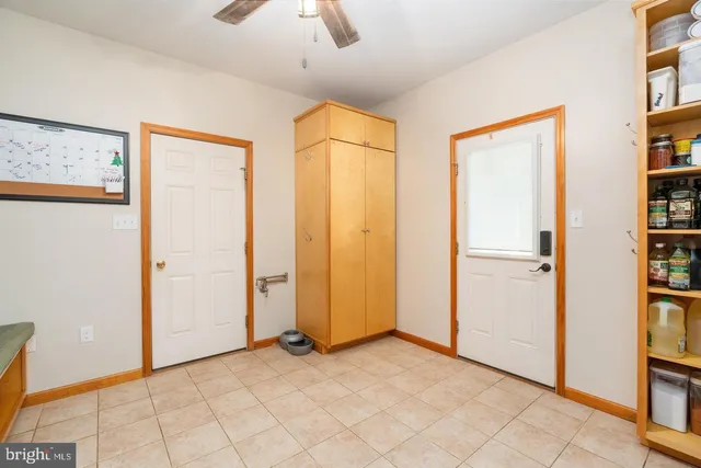 a bathroom with a tub sink and a large mirror