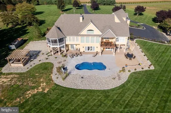 an aerial view of a house with outdoor space