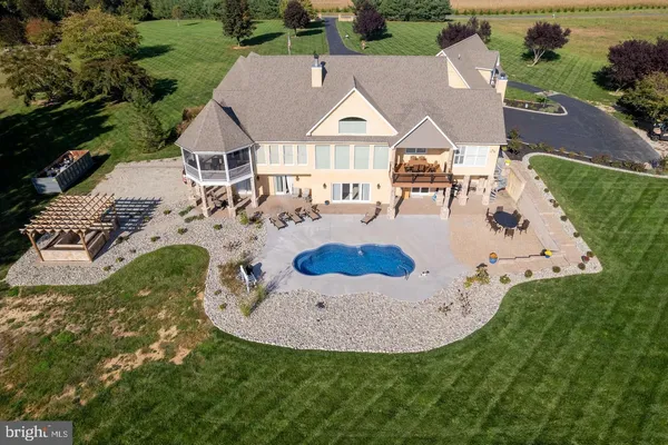 an aerial view of a house with outdoor space