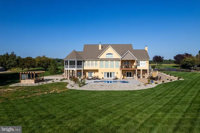 a view of a house with a yard porch and sitting area