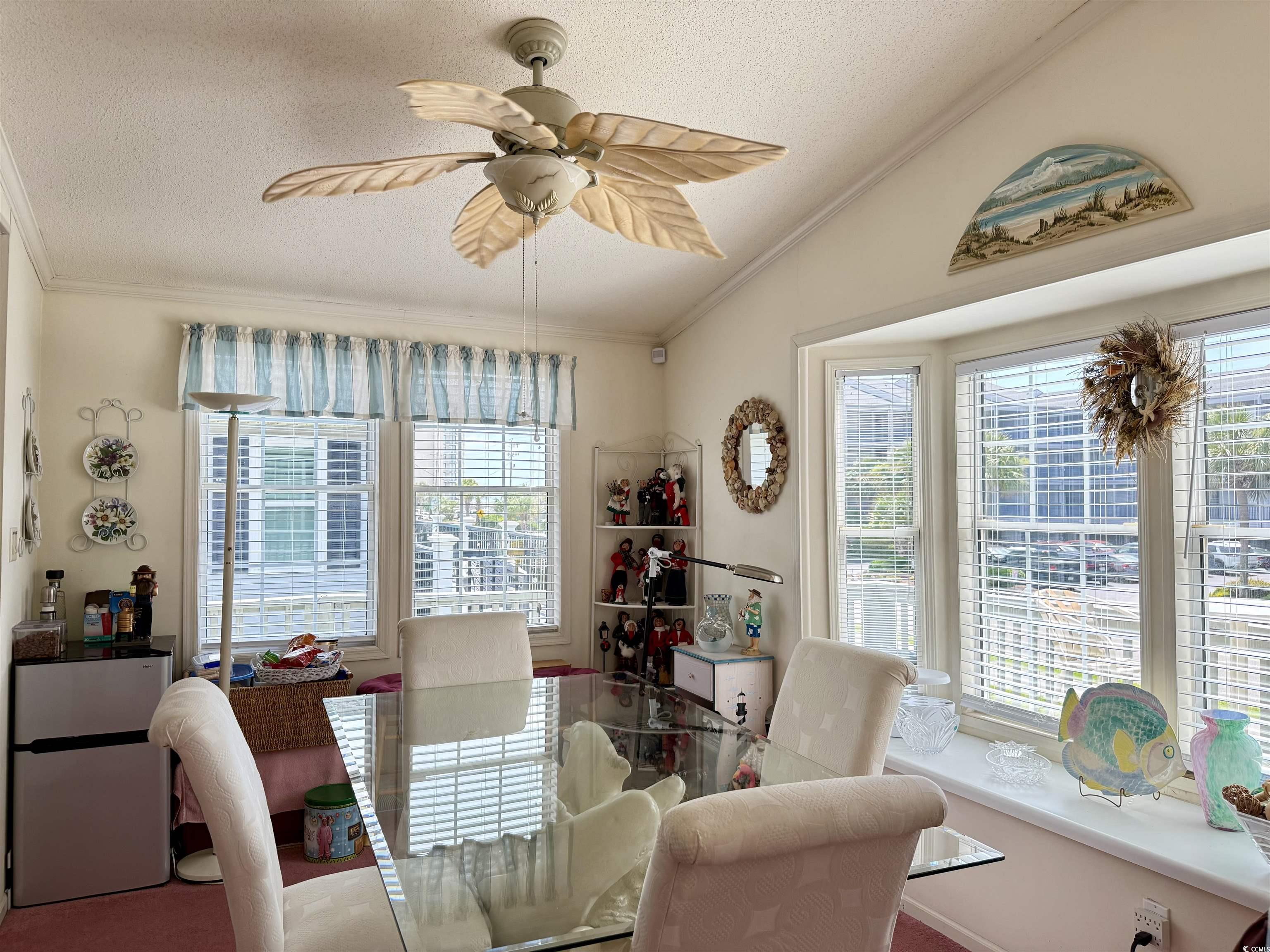 1506 Mason Circle Surfside Beach, SC 29575 - Photo 5 of 33 Dining room with ornamental molding, vaulted ceiling, a textured ceiling, and ceiling fan
