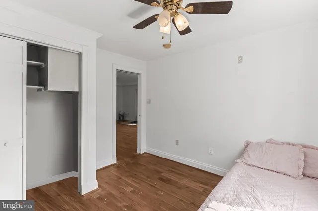 a view of room with wooden floor